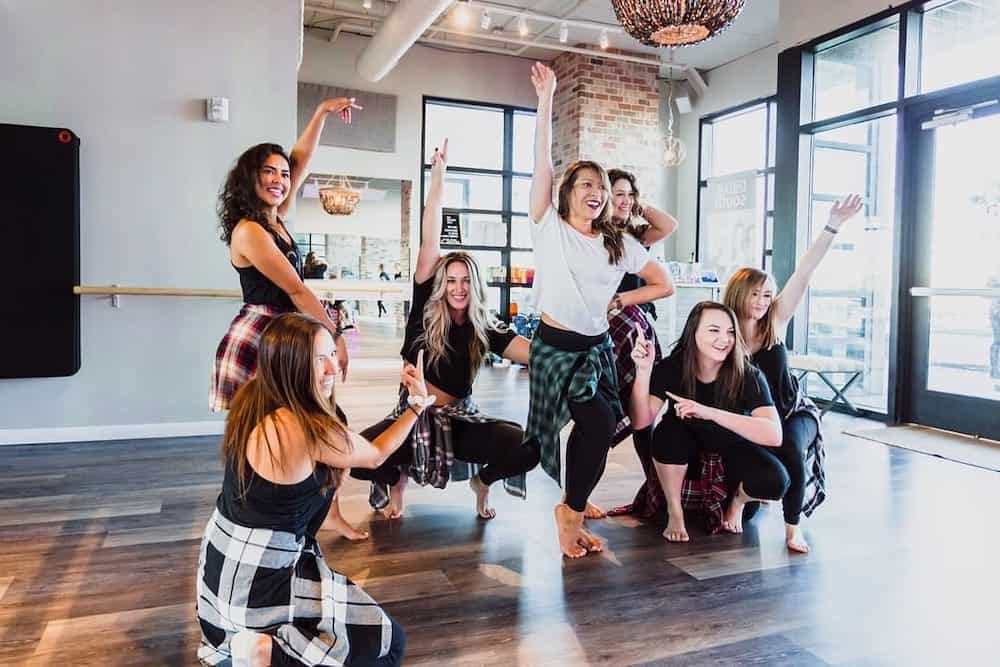 a group of women posing after taking a private DivaDance class, perfect for bachelorette parties in dc
