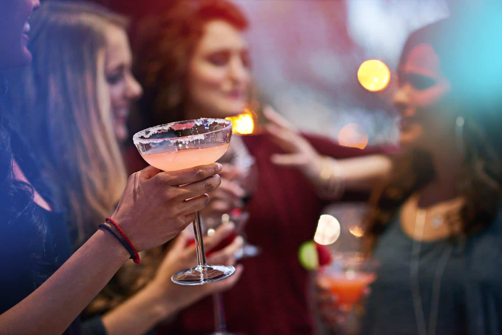 A group of women holding martinis at a bachelorette party in Hoboken.