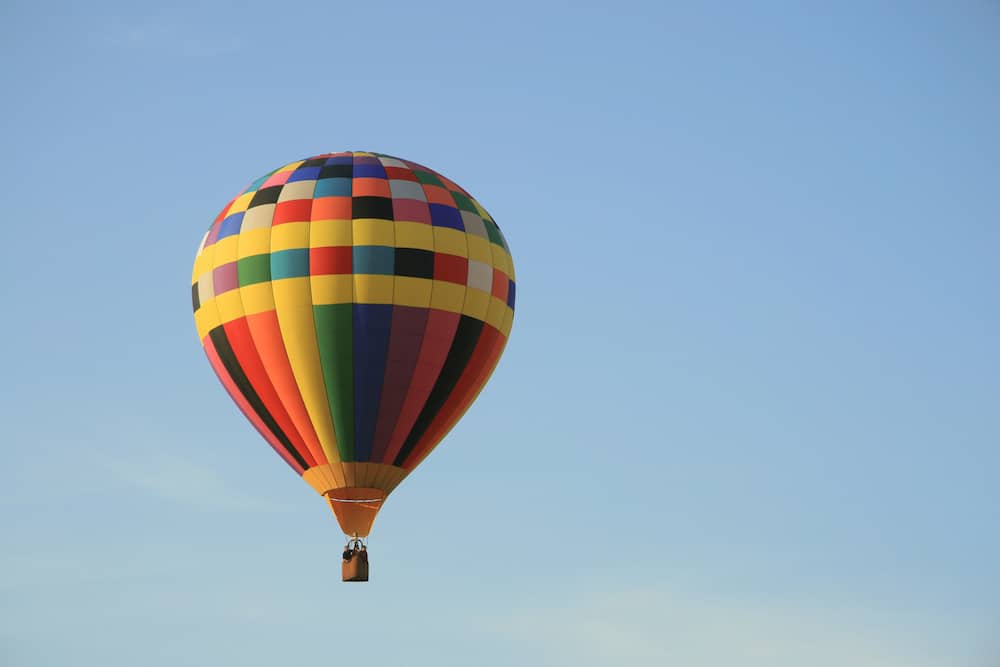 A hot air balloon flying in the sky.