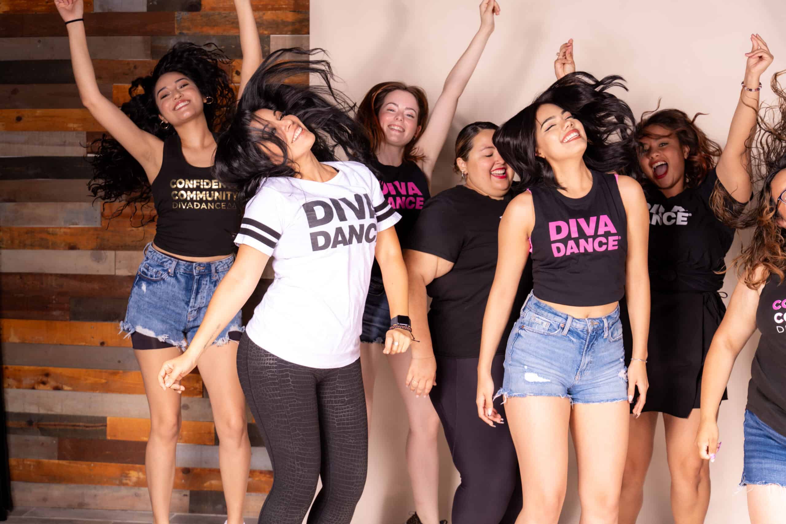 A group of young women celebrating a bachelorette party at DivaDance in Mexico City, posing for a photo.