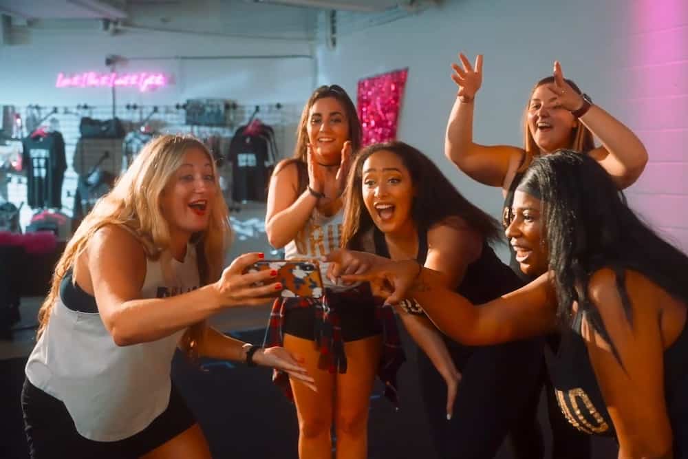 Group of women taking a selfie together in Sandy Springs, expressing joy and excitement at a bachelorette party at DivaDance