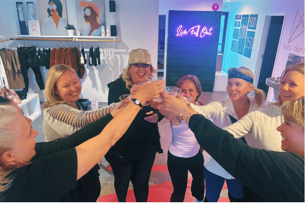 A group of women toasting after a DivaDance class, one of the best bachelorette party ideas in Northwest Arkansas.